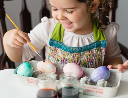 painting easter eggs with watercolor paints