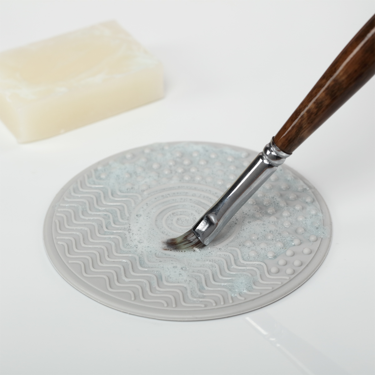 Silicone Cleaning Pad helps dislodge stubborn paint trapped in bristles