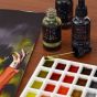 Each bottle includes a glass pipette for easy color application