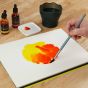 Dried areas of color can be reactivated with a wet brush
