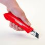 Hand held adjustable depth utility knife with snap-off blade