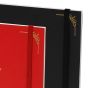 Elastic band holds journal closed for travel