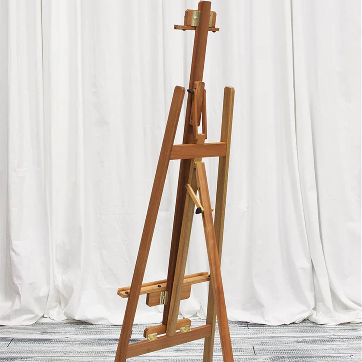 An adjustable A-frame easel with a canvas holder that adjusts on the center mast